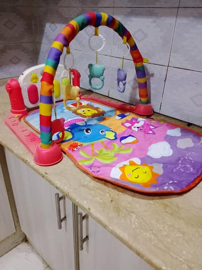baby cot and playing mat