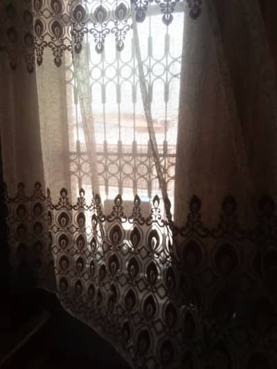 Camel brown leather curtains along with steel length