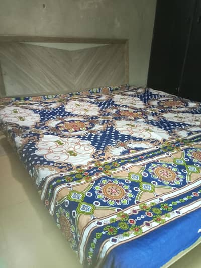 bed with dressing and side tables