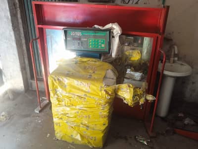 This image shows a Lotus brand digital wheel balancer machine.