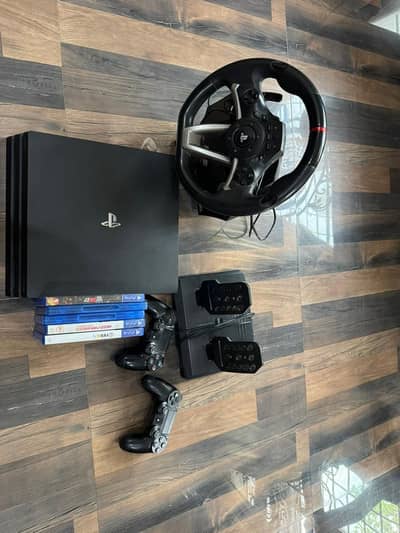 PS4 Pro 1 TB + Rwd Steering wheel apex + 5 Cds up for sale