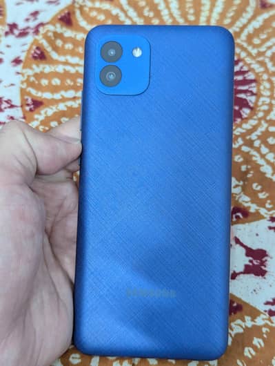 Samsung Mobile A03 with charger.