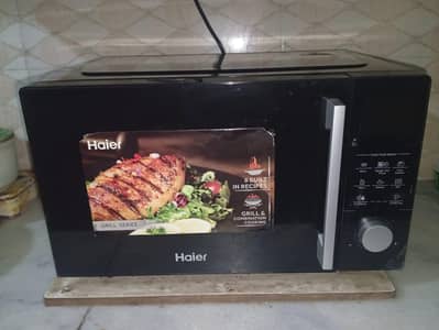HAIER MICROWAVE OVEN Model: HMW 28100DG