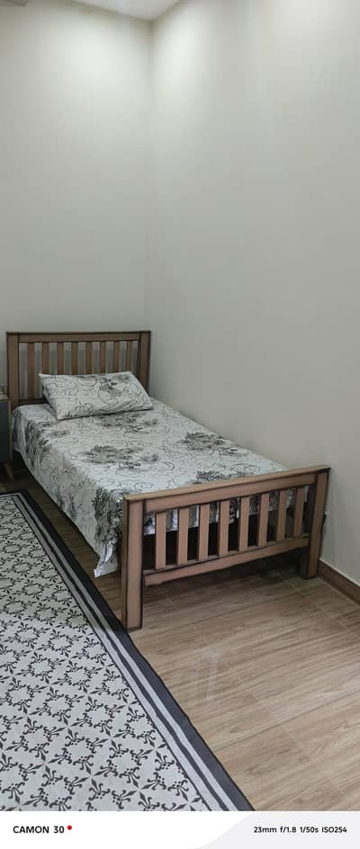 single wooden bed