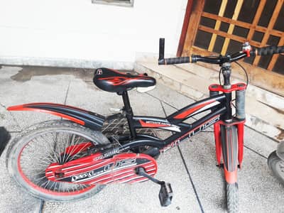 Red and black bicycle for sale