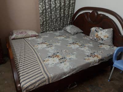 Polished Wooden Bed