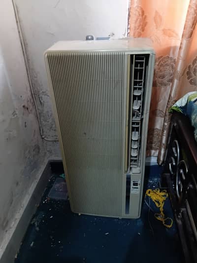 Corona brand window air conditioner featuring a prominent beige front