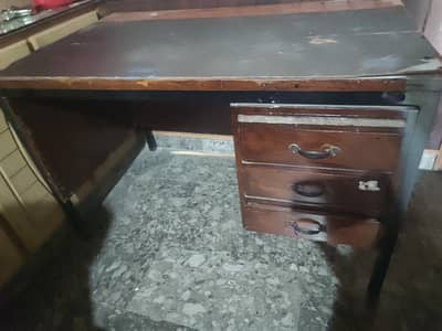 old wooden table with 3 drawers & iron frame