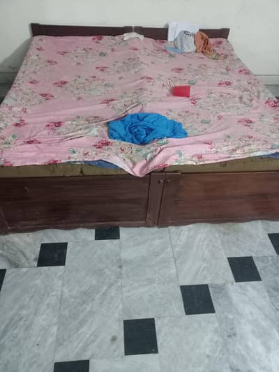 A pair of bed set made of pure wood.
