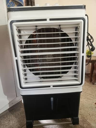AC DC air cooler medium size and 1 week used brand new condition