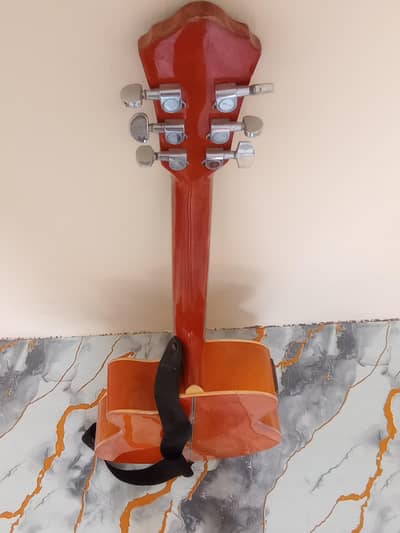 40 inch Sami acoustic guitar with turner