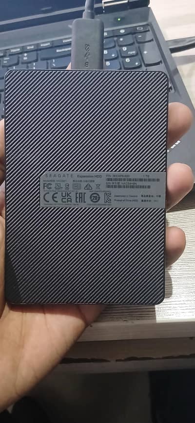 External Hard Drive with a 1TB storage capacity.