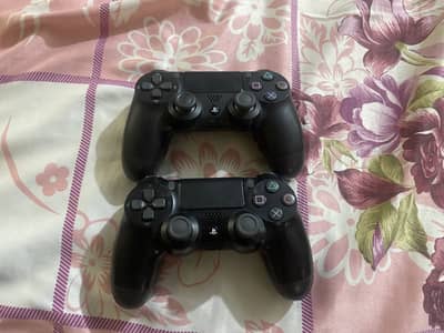 Pair of used play station controller and games