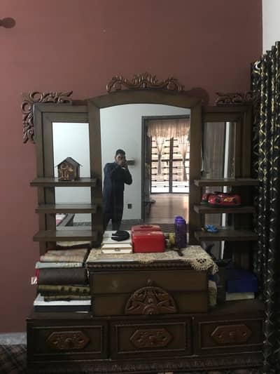 Double bed with side table and dressing table