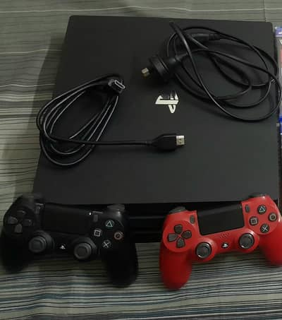 PS4 PRO 1 TB WITH 2 CONTROLLERS MINT CONDITION SLIGHTLY USED