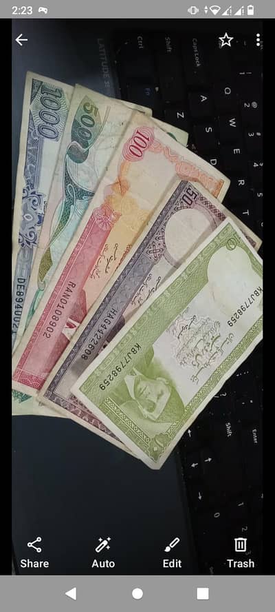 old Pakistani notes and coins