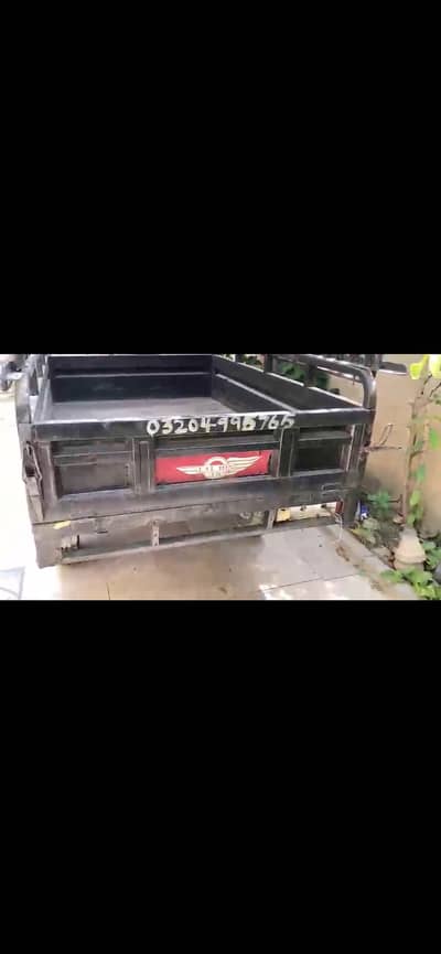 Lal Din Loader Rickshaw with roof for rent.