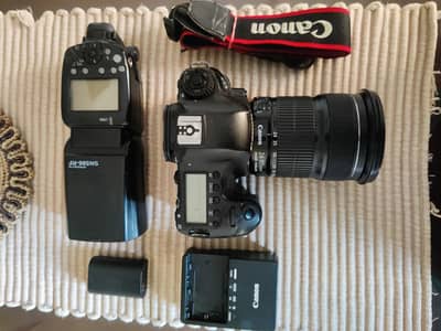 Canon 6d dslr camera with 24-105mm lens and flash