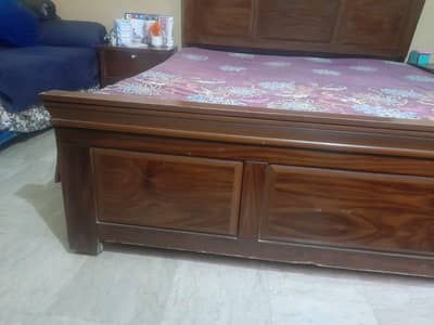 double bed with side table and matters