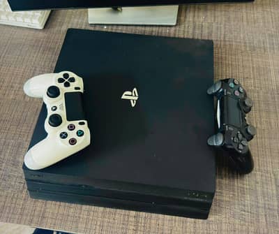 PS4 Pro 1 TB with 2 Controllers and 3 Games.