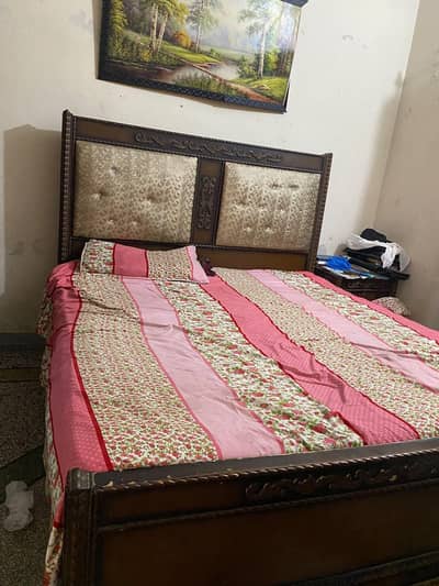 double bed with 2side tables and dressing table