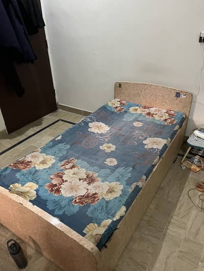 Single bed, cupboard, divider