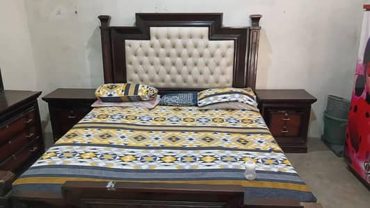 wooden bed with matris
