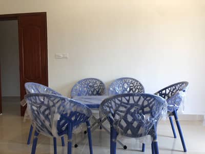 Plastic chairs with table
