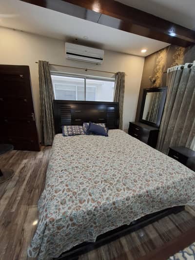Bed with side table chairs table and dressing