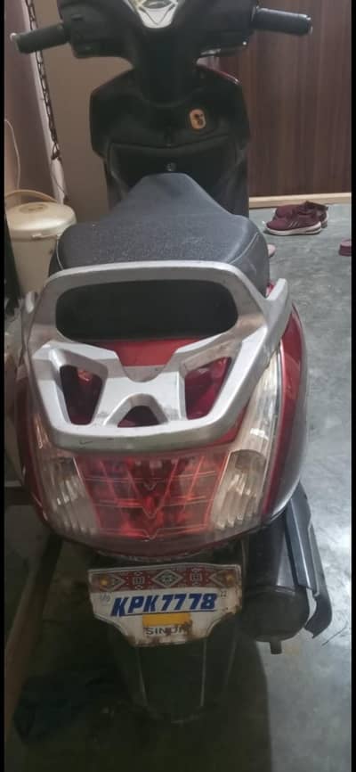 united scooty 100cc