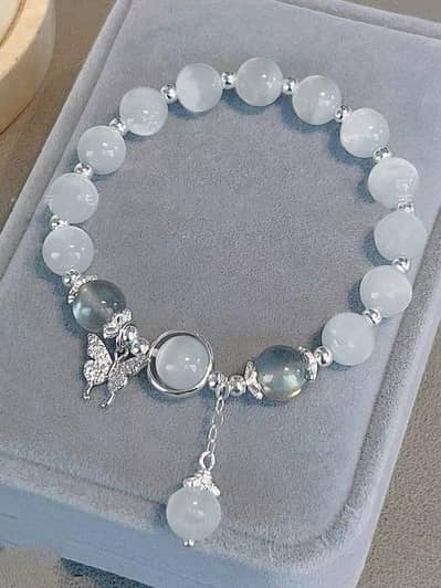 glass-beaded bracelets in diffrent colours with cute charms