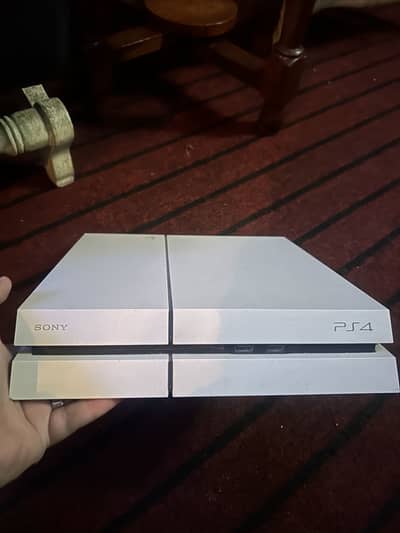 PS4 fat version with 2 controllers and 3 Games and 2 pre instal games