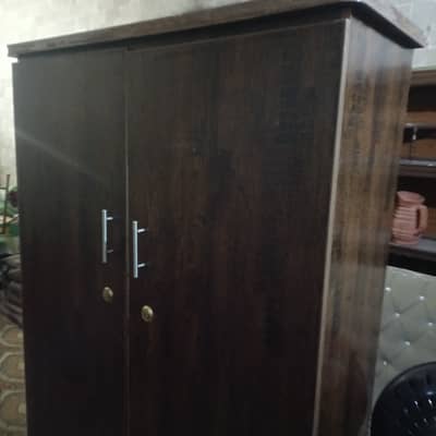 Cupboard with hanging and wheels to move