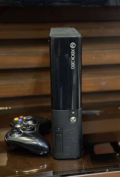 Urgent sale :Xbox 360 and its original controller with 10 games in it.