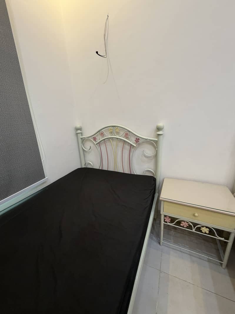 Single bed with side table 0