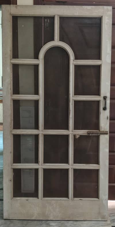 heavy and strong wodden door with metal handle and bolt