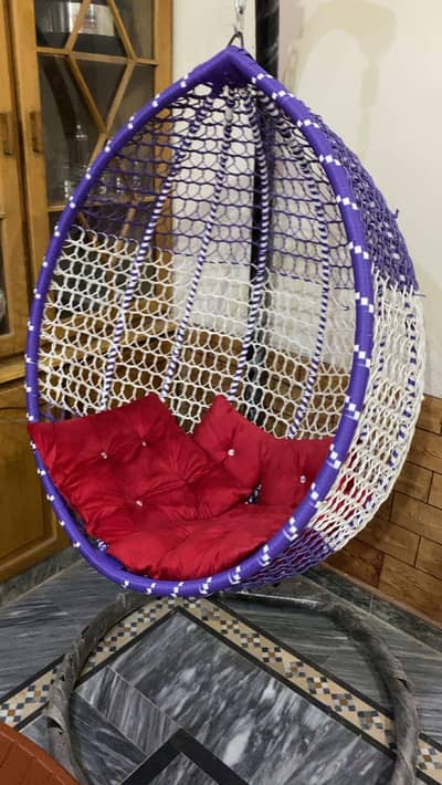 Swing with cushions