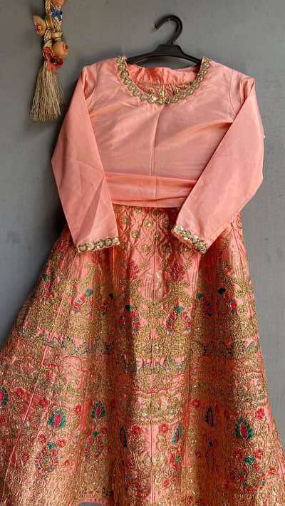 Peach silk shirt with heavy embroidery lehnga and hand printed dupatta