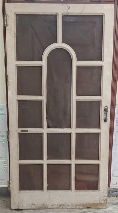 wodden door with metal handle and bolt