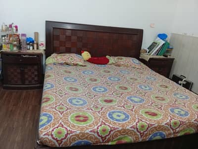 bed with dressing and sidetables