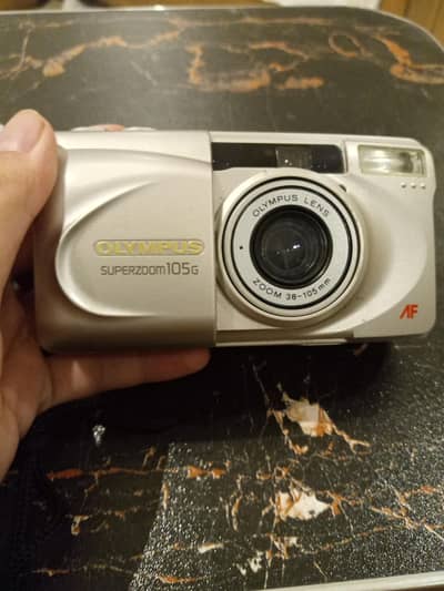 Olympus super zoom 105g reel camera
