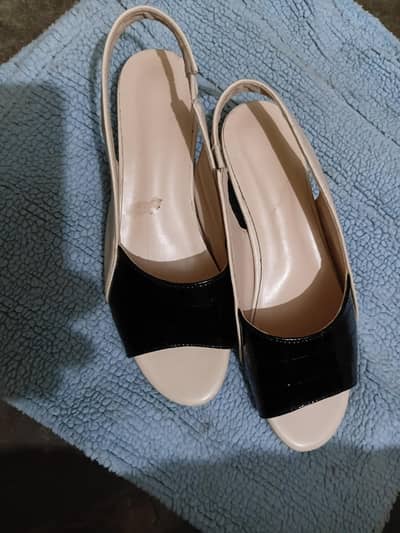 skin and black in colour shoe