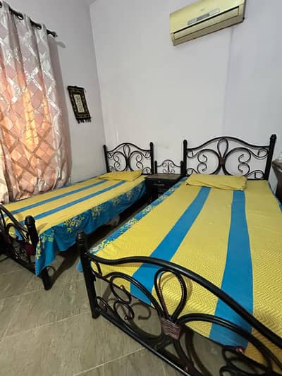Single metal beds with side table