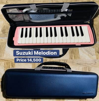 Suzuki Mendion with hard case . Piano. Keyboard. Map. Bass. Electric