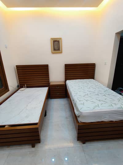 2 single beds with 1 center table