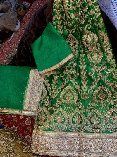 Green and pink 3pc lengha dress.