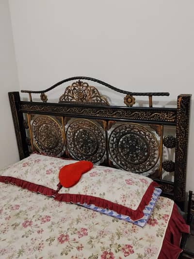Iron bed with side tables