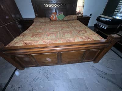 full size double bed with dressing and side table