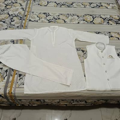 Alkaram kurta trouser and waist coat wore once. just like new