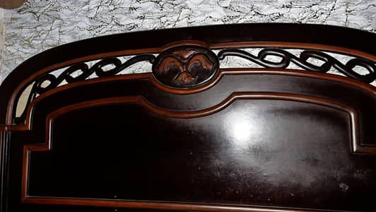 wodden bed with  two side tables